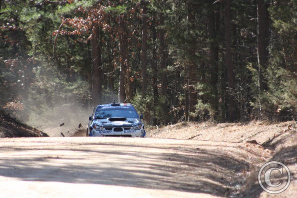 Sticks and stones go flying as Yeoman and Schulze approach the hairpin in stage 1 of the Rally in the 100 Acre Wood 2014